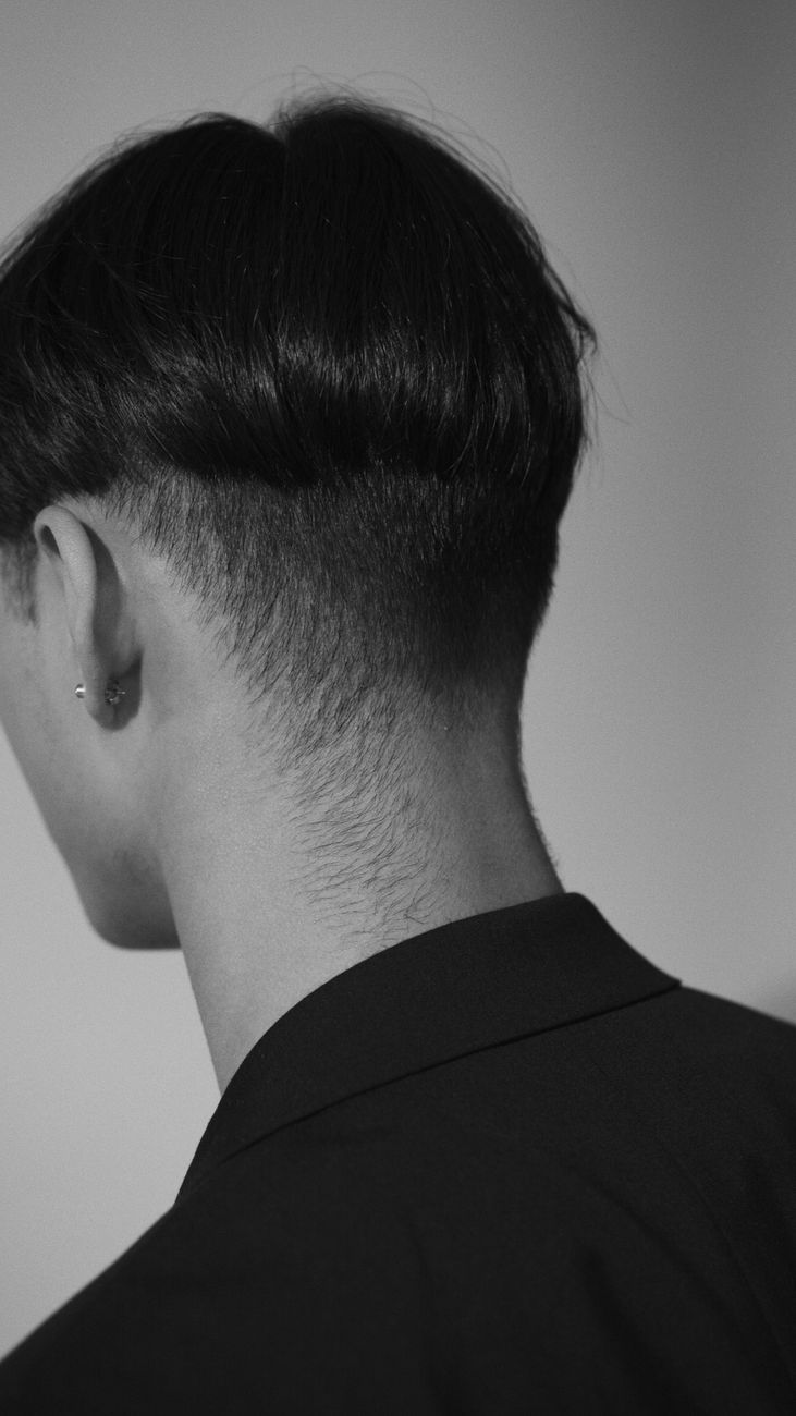 grayscale photo of the back of the head of a person