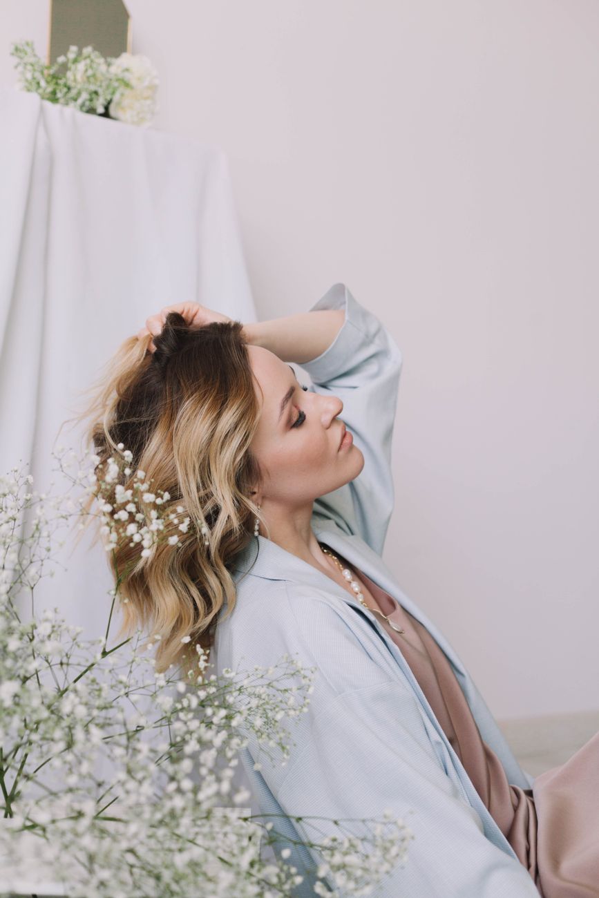 elegant woman posing in white interior