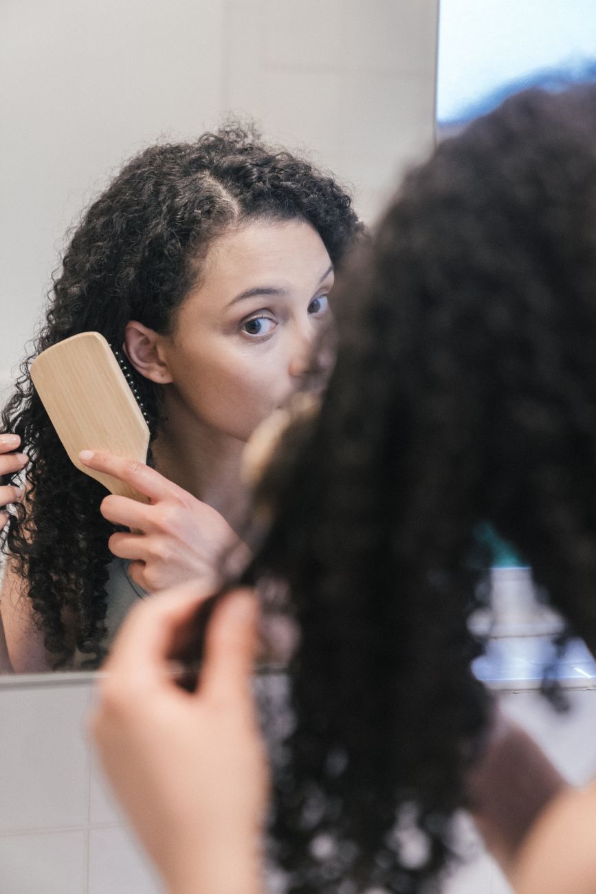 woman brushing her hair