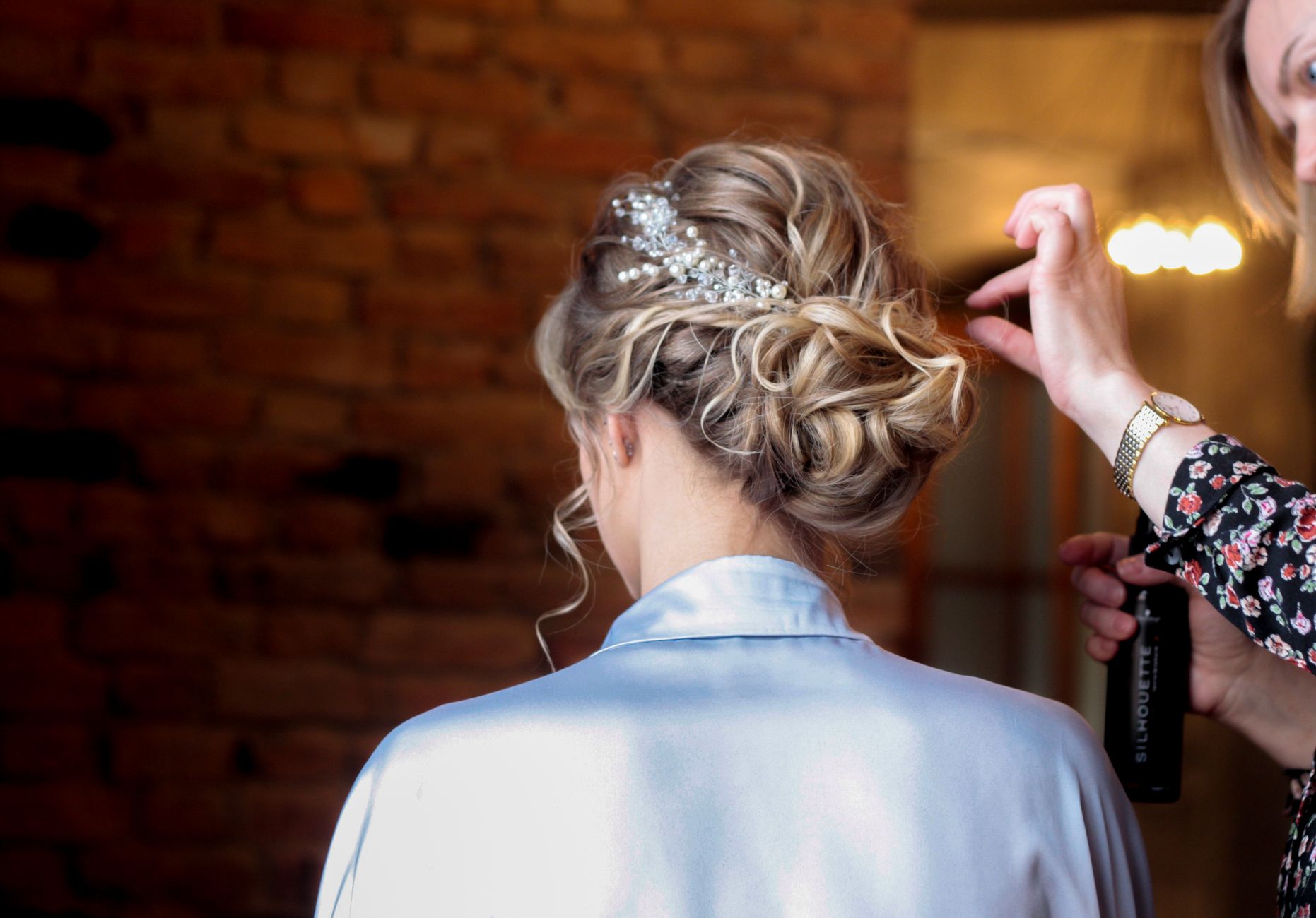 Celebrating Every Milestone with Expert Styling at OP Hair Salon 1 a hairstylist fixing a bride s hair