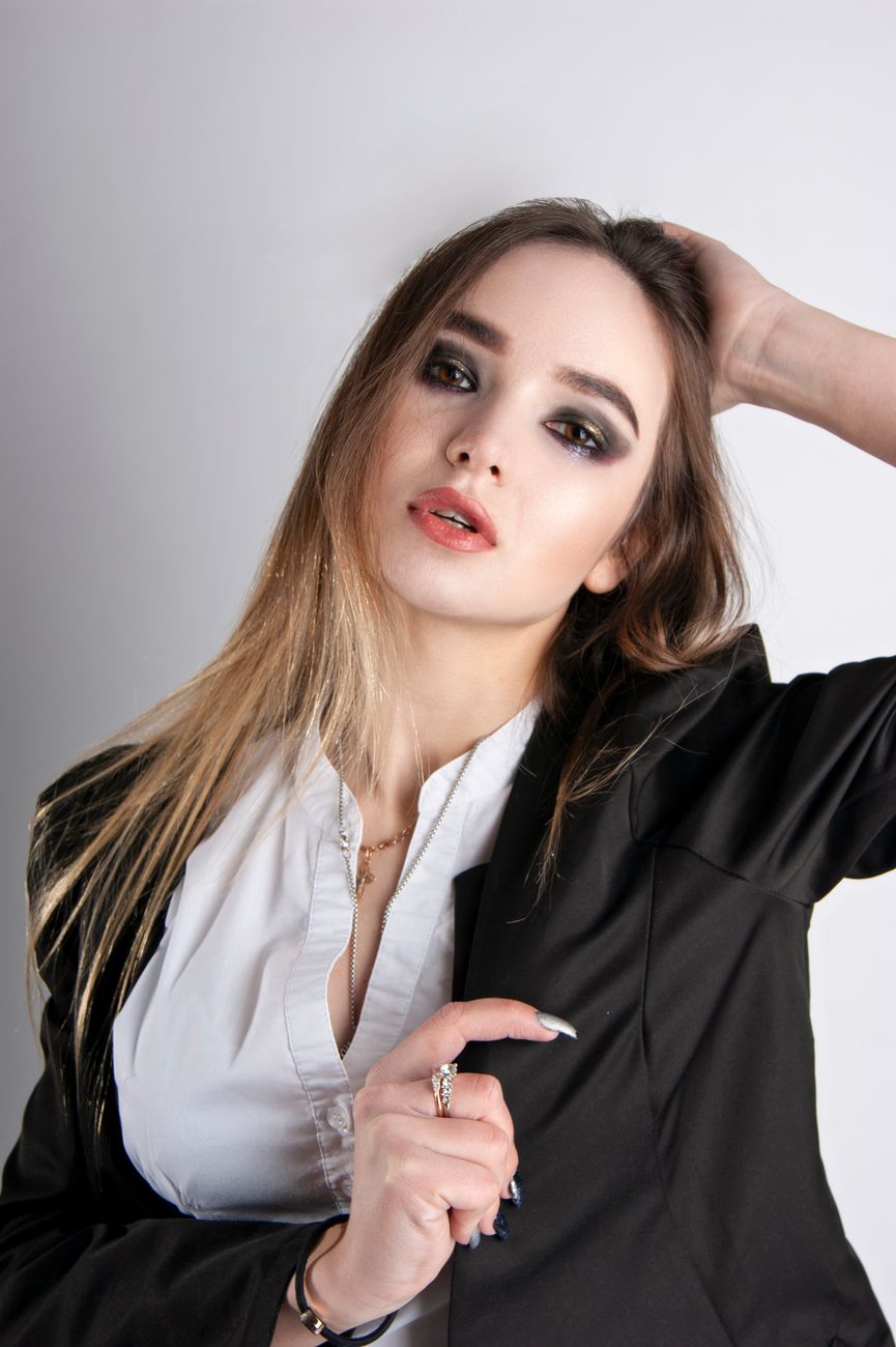 Smokey Ash Balayage for Sleek Edgy Styles 1 portrait of a woman on a white background
