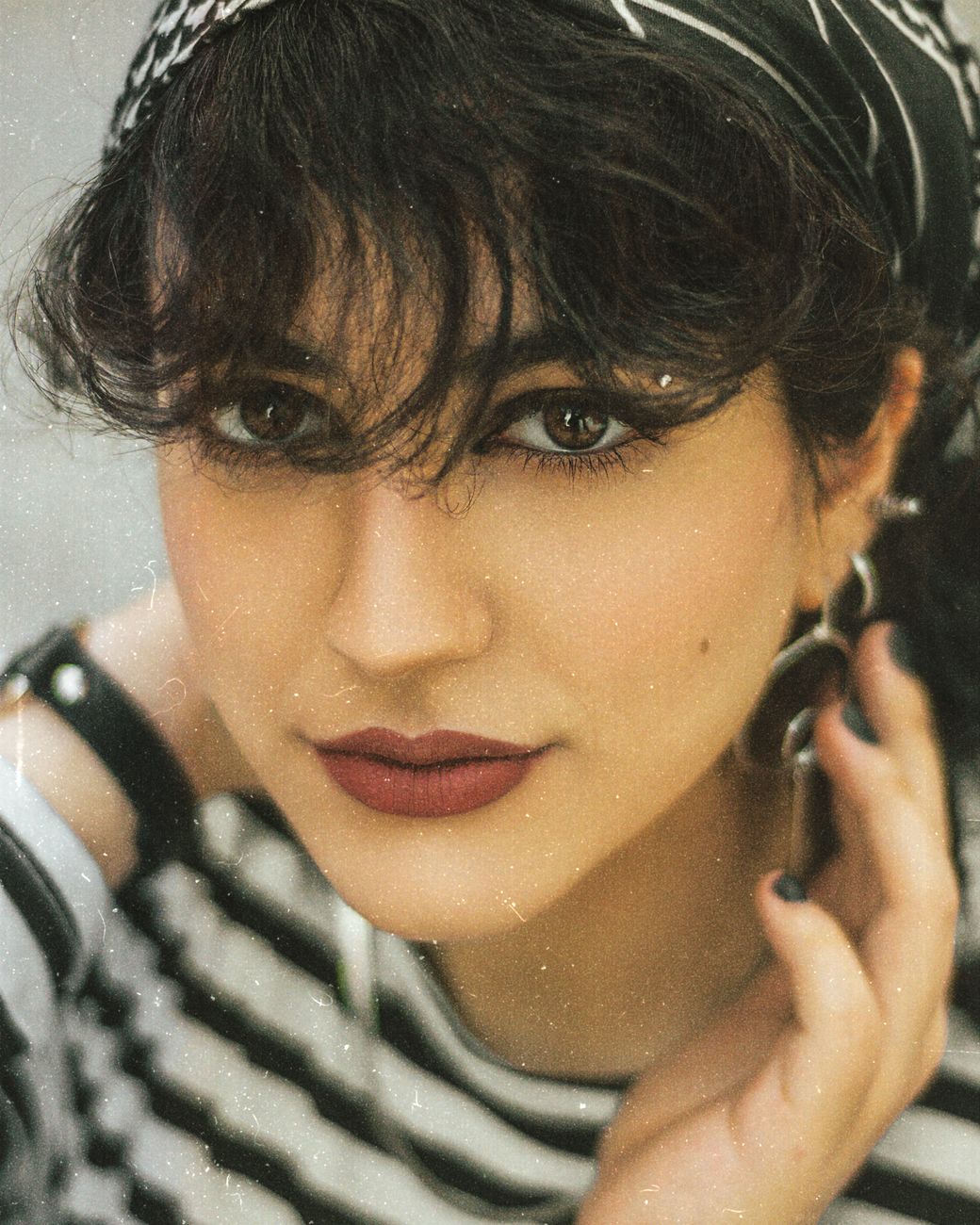 Curtain Bangs 101: How to Style and Maintain Them 1 portrait of a woman with a beautiful face