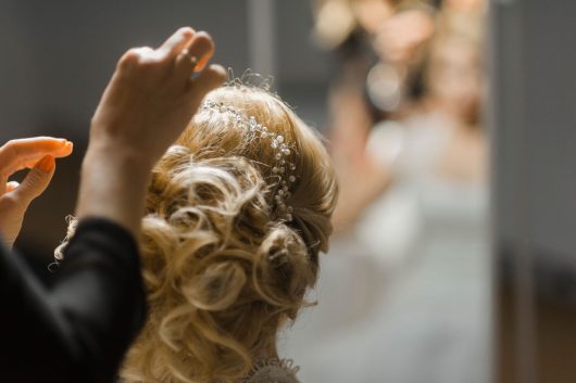 a woman wearing pearl hair accessory