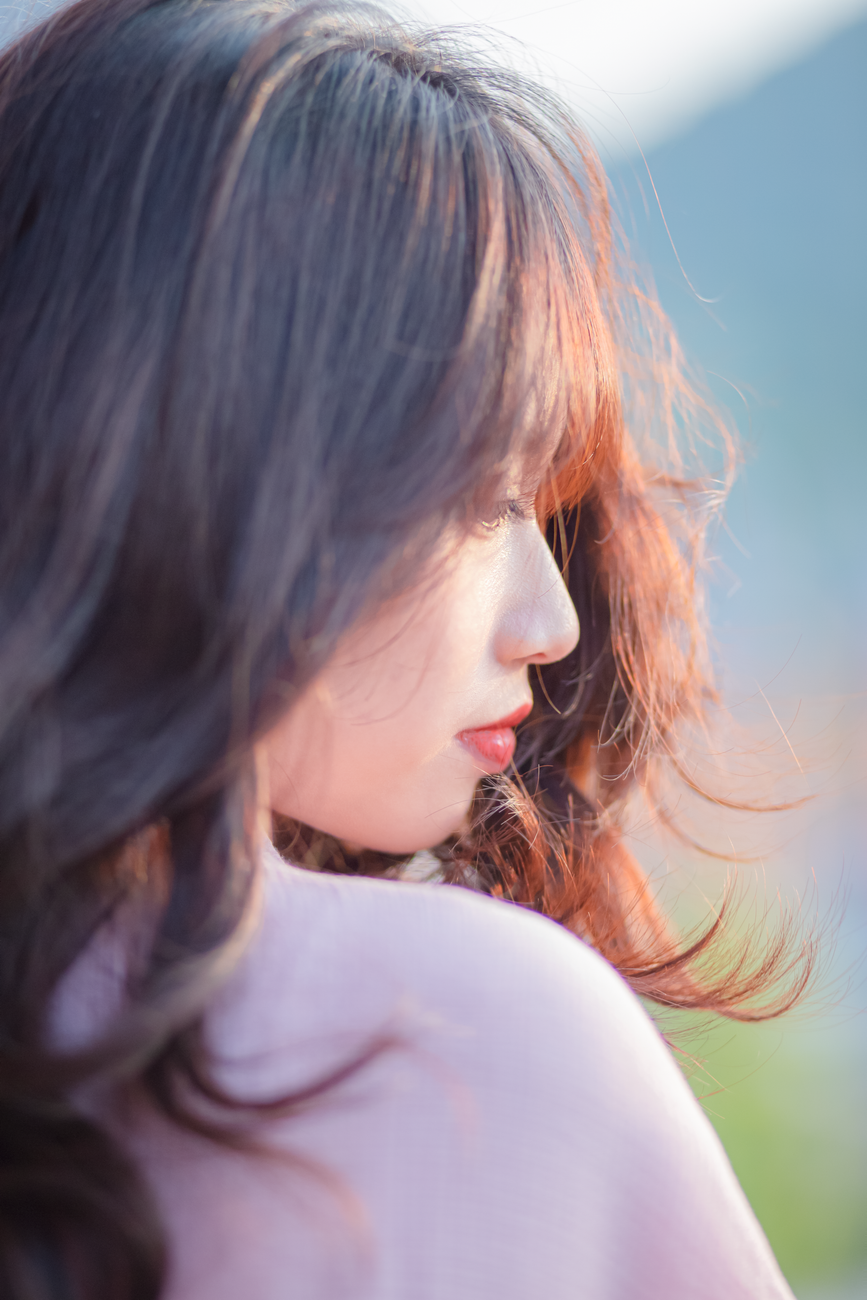 side portrait of a young brunette