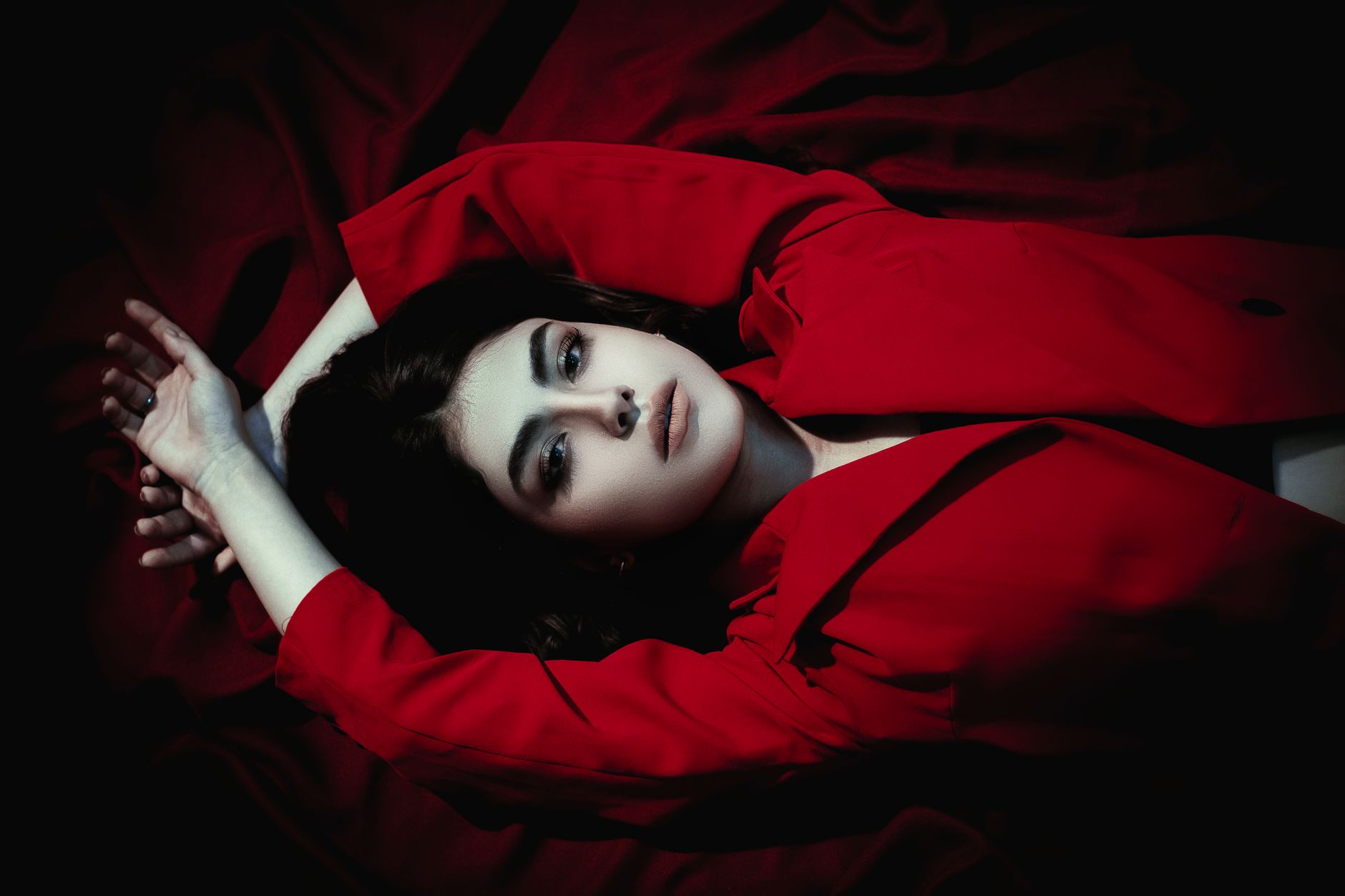 Vivid Red Hair Color Formulas and Maintenance 1 woman in red coat lying down