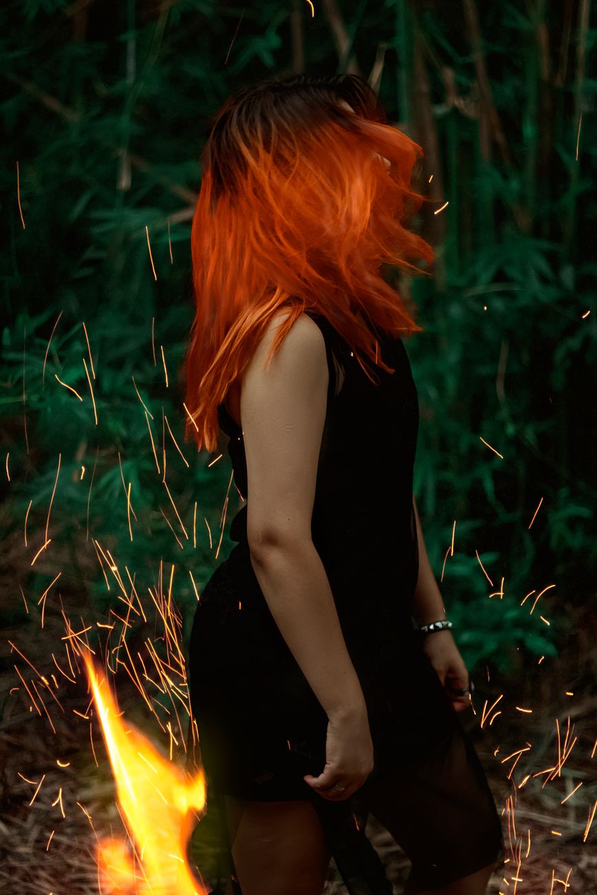 Flame Hair Color: Yellow, Orange, and Red Ombré 1 woman in black dress