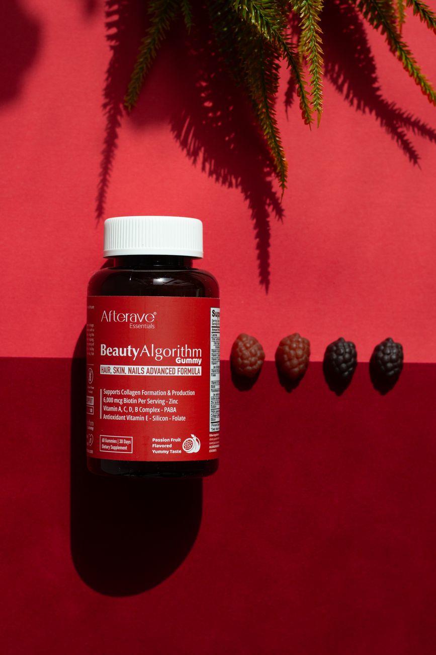 The Connection Between Diet, Hydration, and Scalp Health 1 biotin supplement bottle on red background