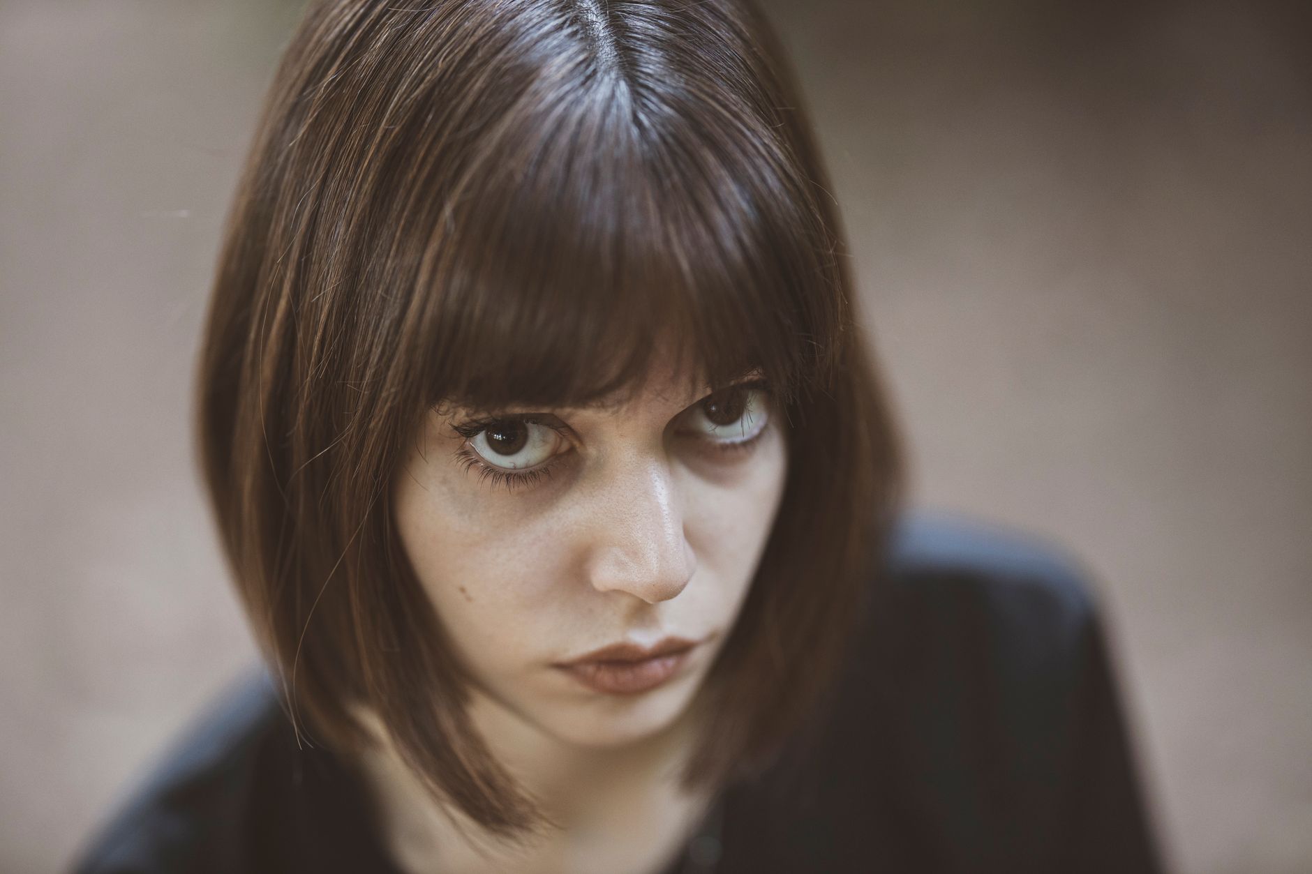 Asymmetrical Bob Transformations at OP Hair Salon 1 woman wearing black top