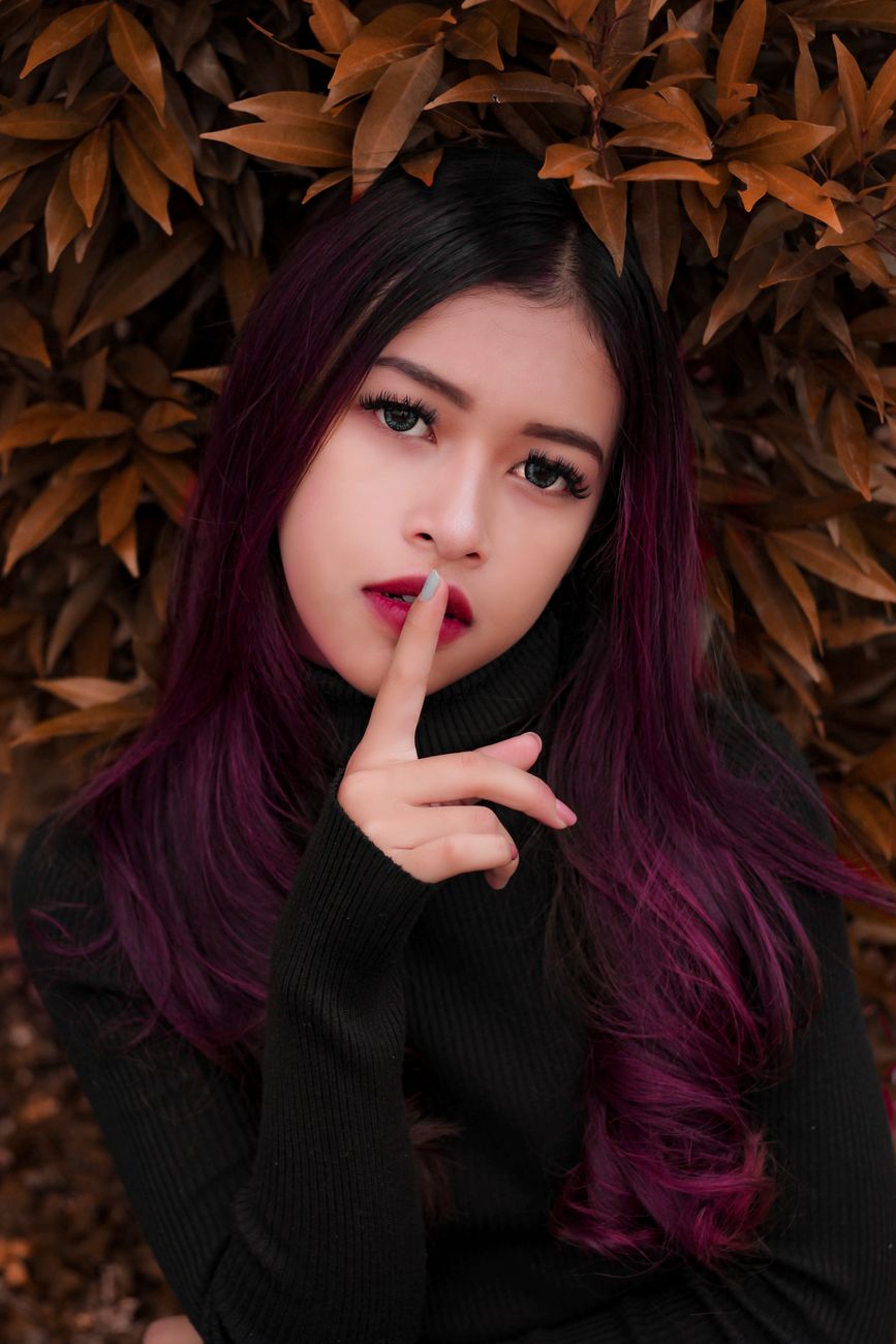 Magenta Melt Hair Art: Seamless Red-Purple Transitions 1 woman s index finger on her lips