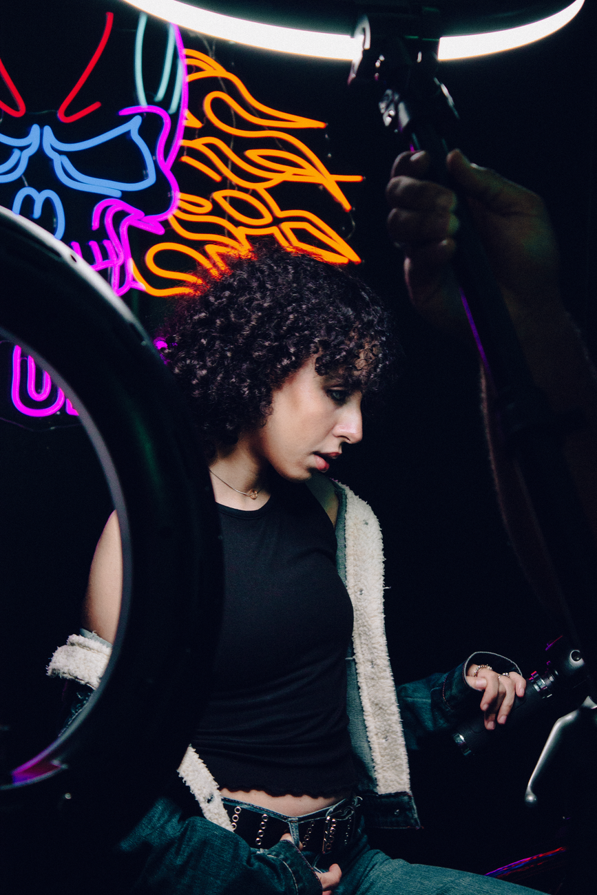 Cyberpunk Neon Hair Trends at OP Hair Salon 1 neon skull with person and vibrant background