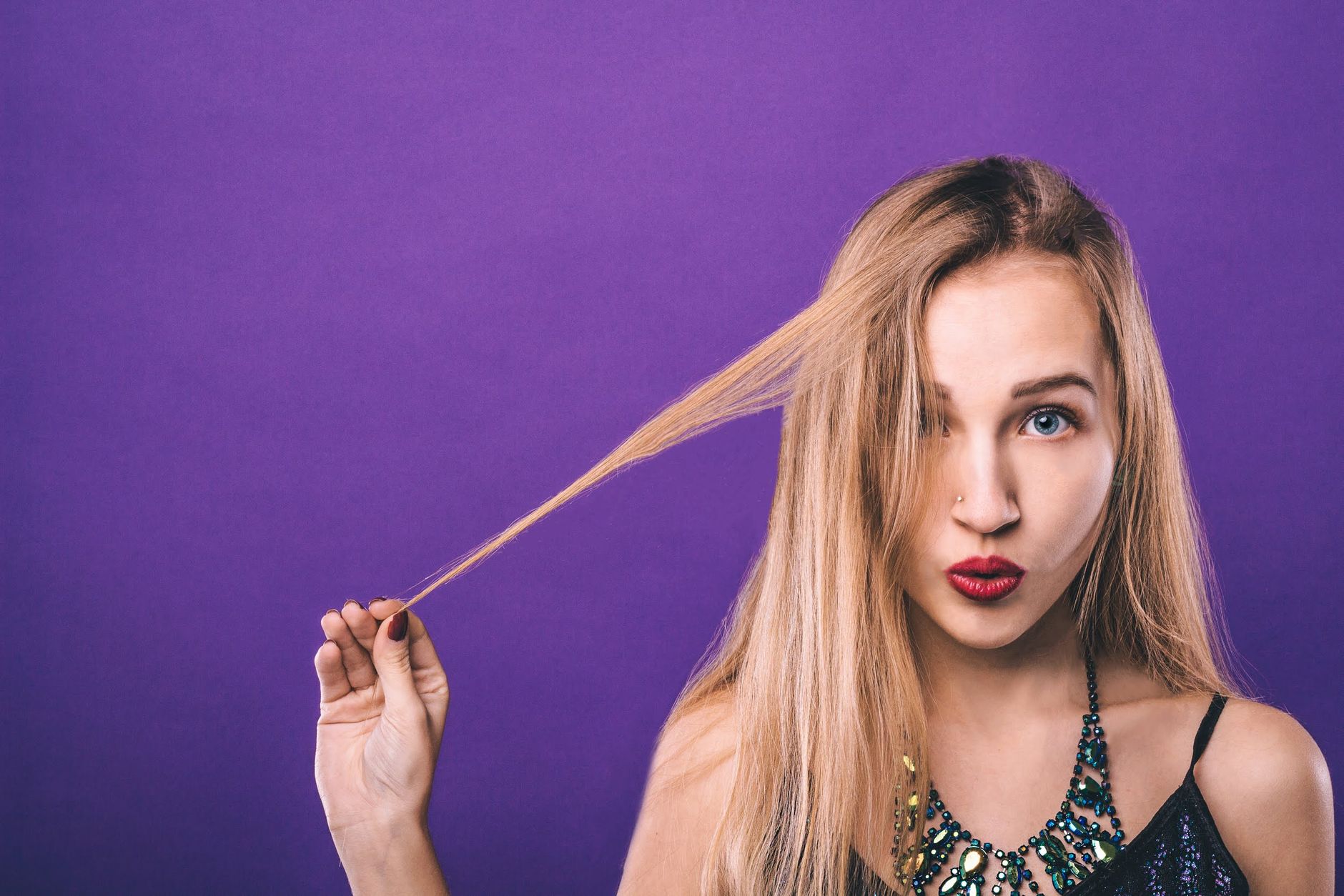 Electric Violet: Vibrant Purple Hair Color Inspiration 1 coquette young woman with red lips in studio