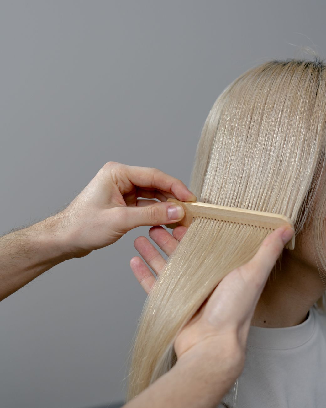 Color Correction to Vivids: Resetting Faded Pigments 1 hand combing the blonde hair