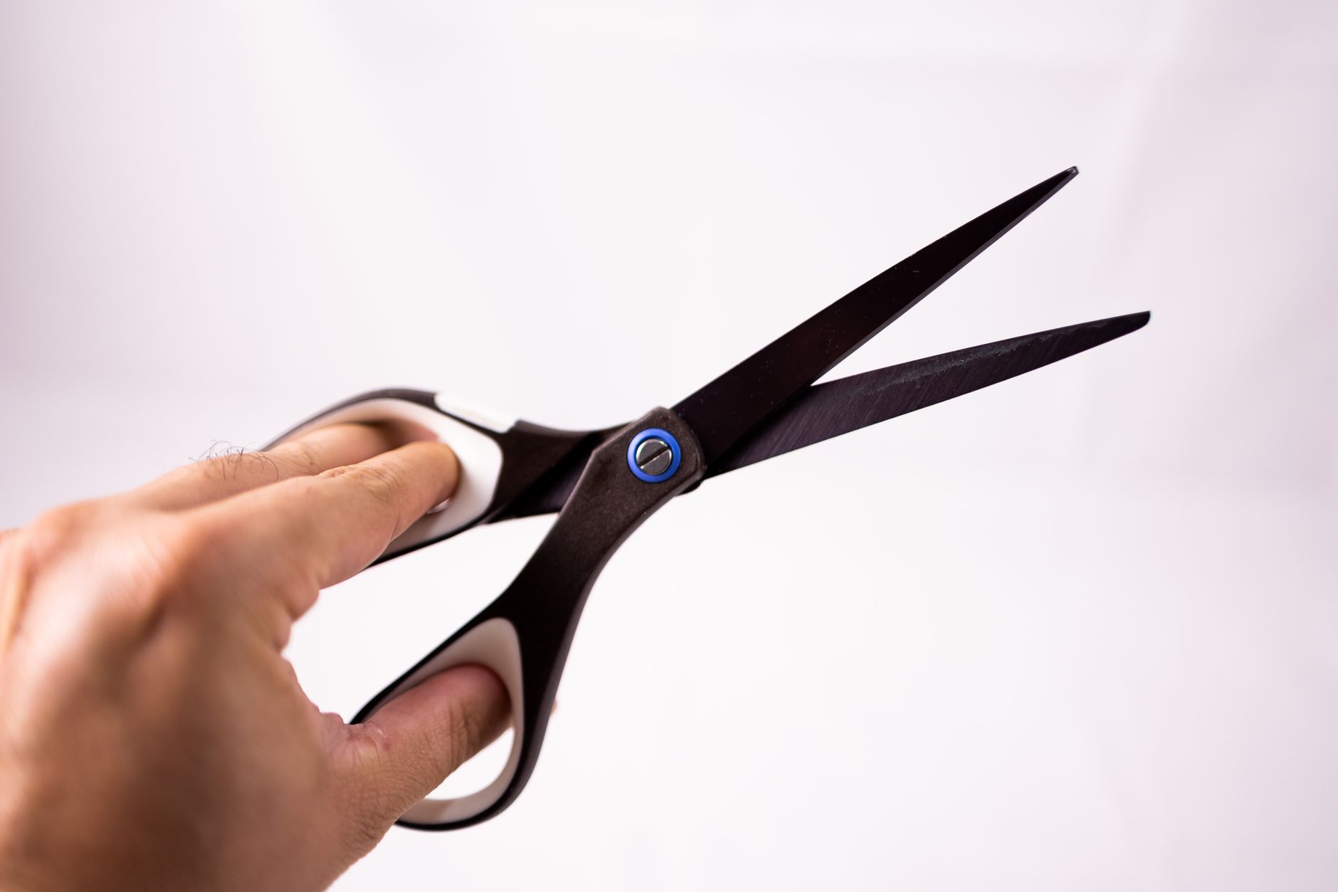 Soft Blunt Edge Cuts for Straight Hair 1 scissors in hand of crop person