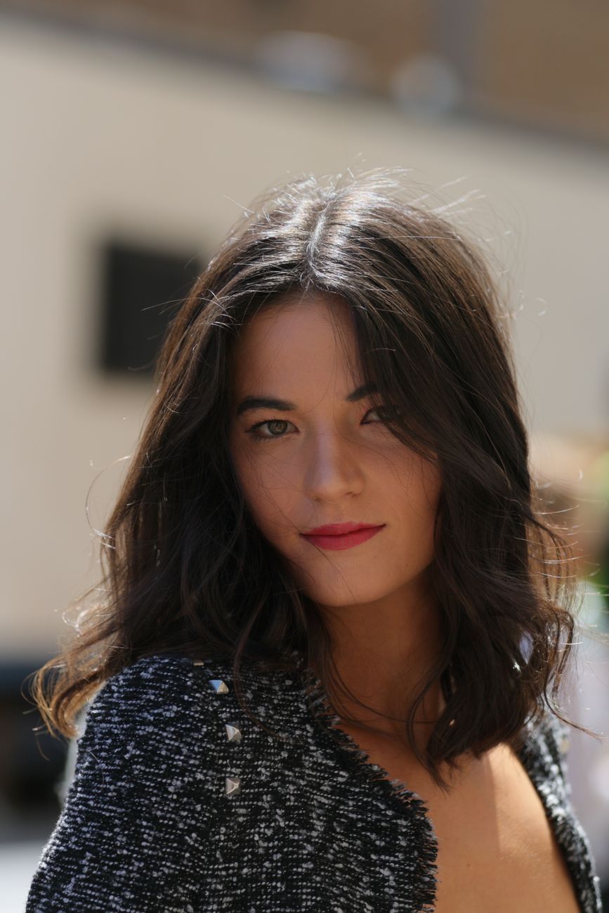 a beautiful woman in black tweed top
