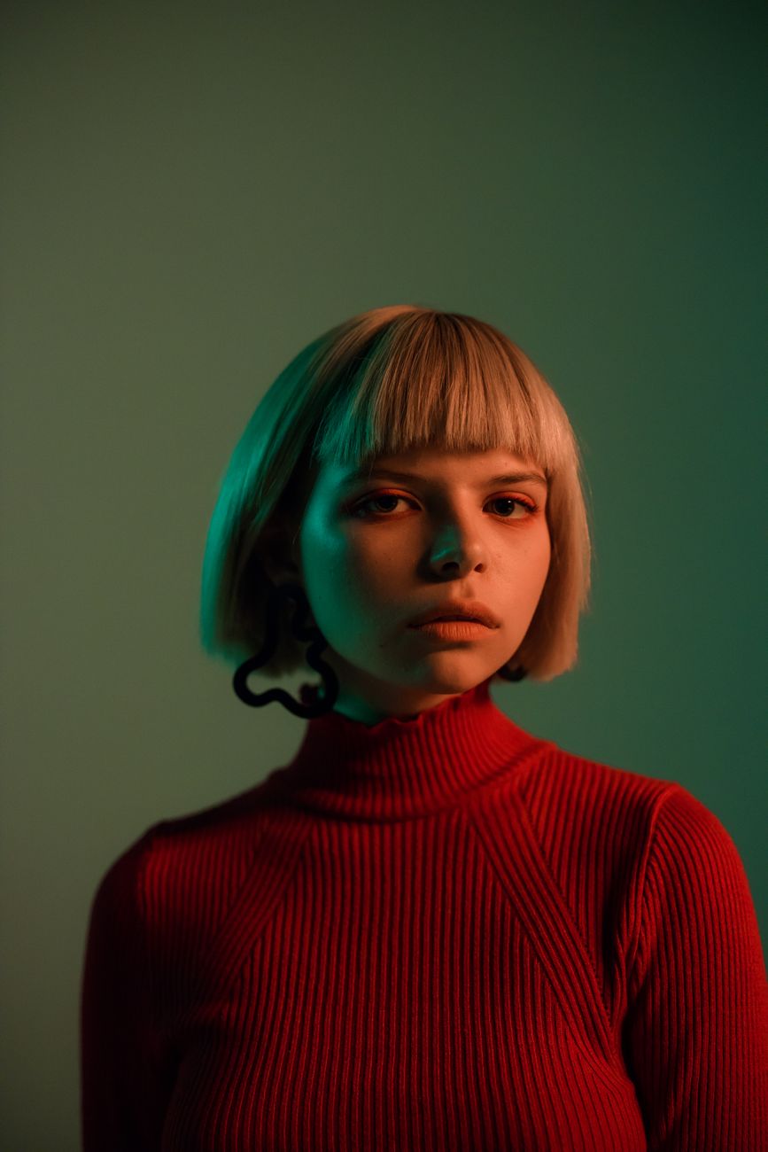 A-Line Bob Cuts: Angle and Structure Simplified 1 close up shot of a pretty woman in red turtleneck sweater