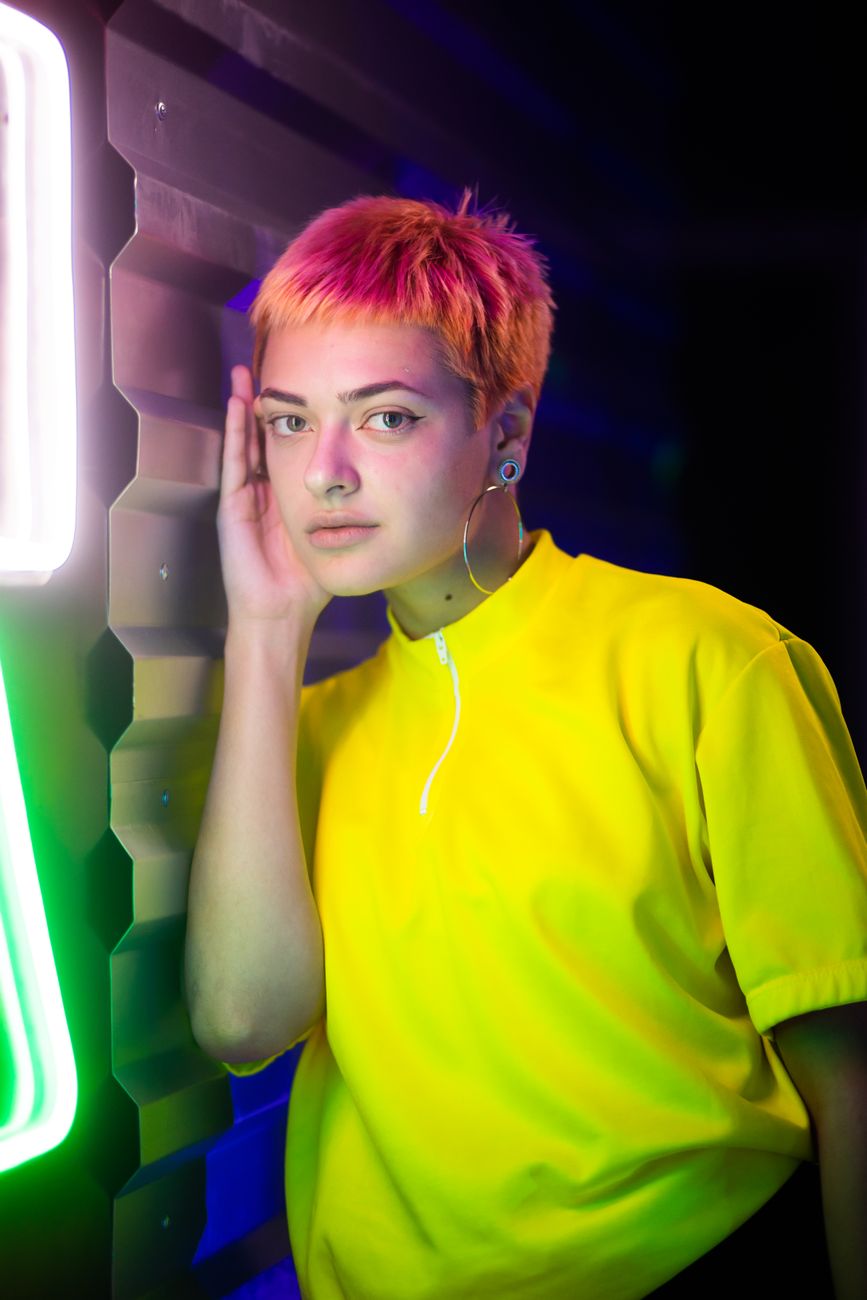 woman in yellow shirt with colored hair