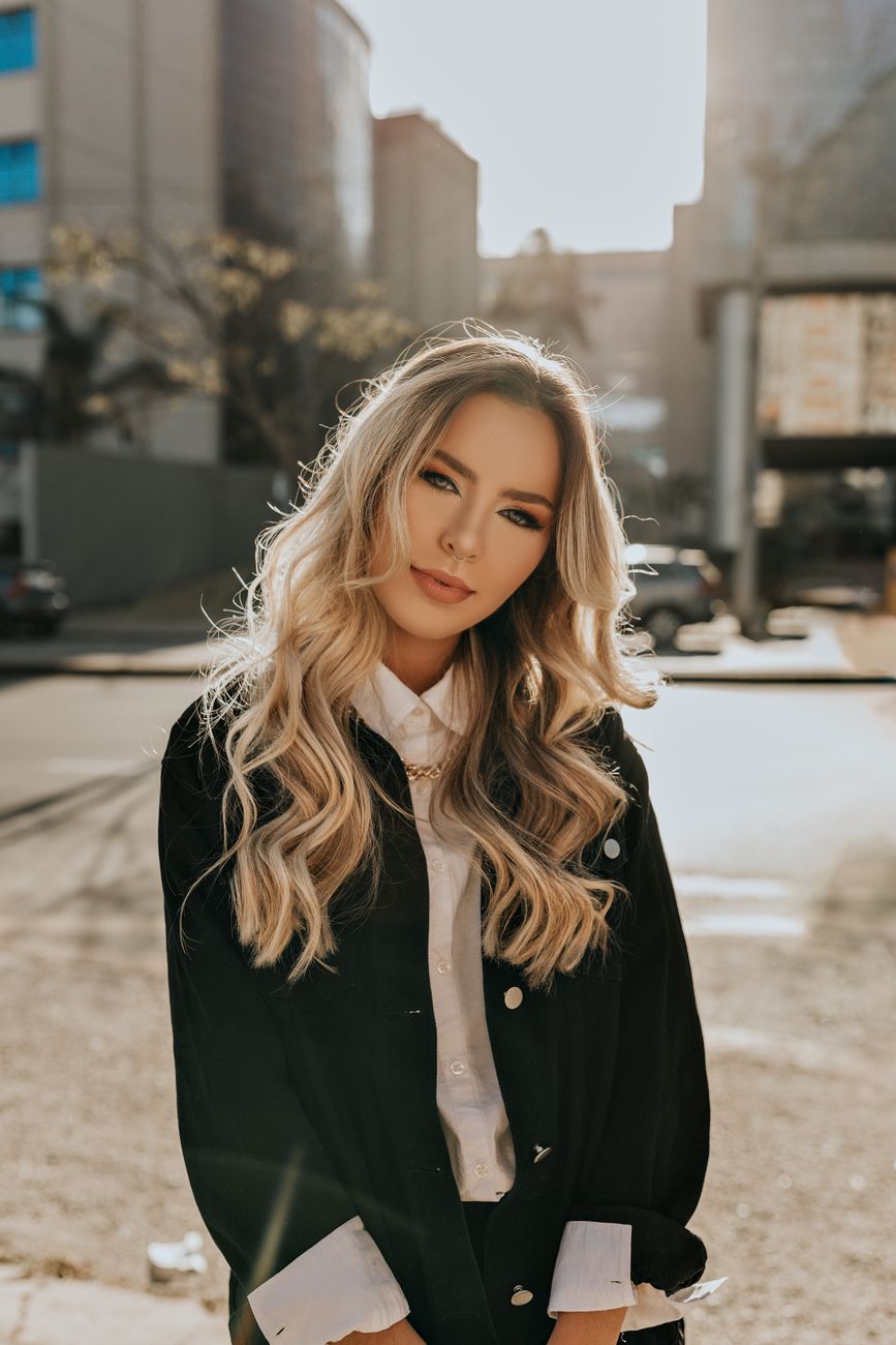 Golden Hour Balayage Tones for Summer 1 woman in black long sleeve shirt standing on road